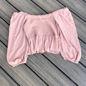 A pink flowey off the shoulder top
